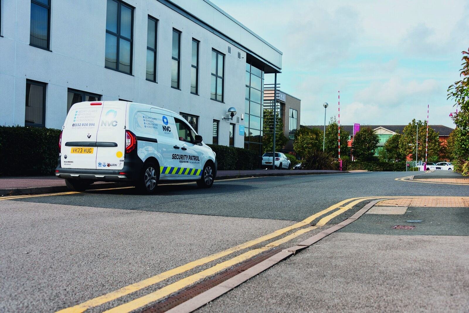 Marked NVC Security patrol vehicle parked on a street